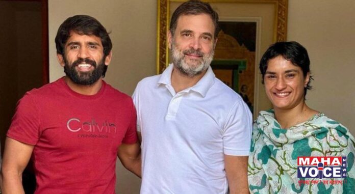 Vinesh Phogat and Bajrang Punia with Rahul Gandhi.